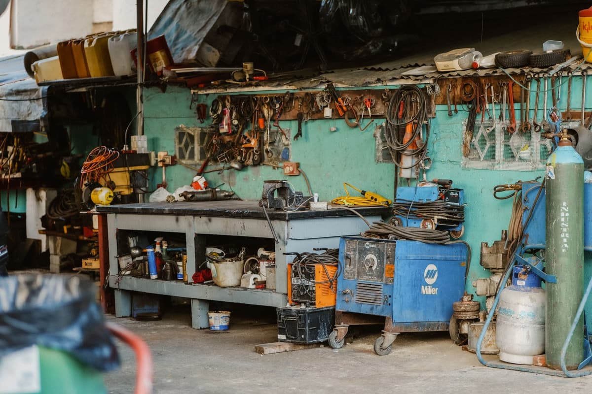 A workshop wall hung with automotive hand tools